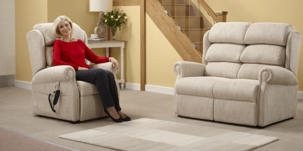 AN elderly lady enjoying her rise and recline chair.