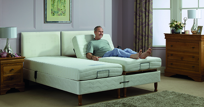 Elderly man on an adjustable bed recovering from a stroke.