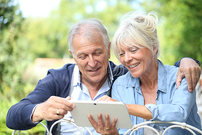 Senior couple using a tablet to browse the internet