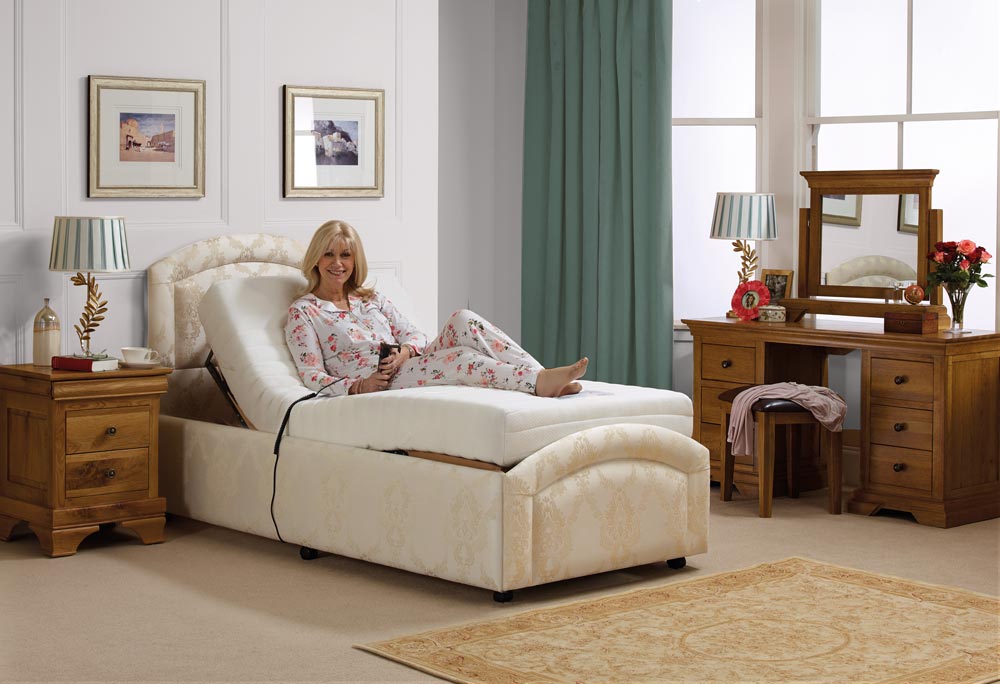 Woman on an adjustable bed holding the controller