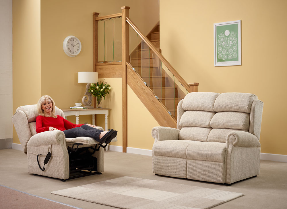 An elderly lady relaxing in a rise and recline chair