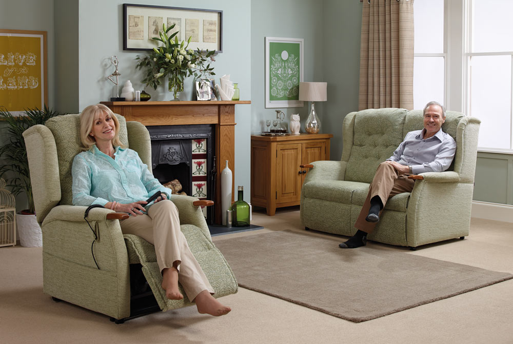 Elderly couple enjoying their rise and recline chair and sofa set