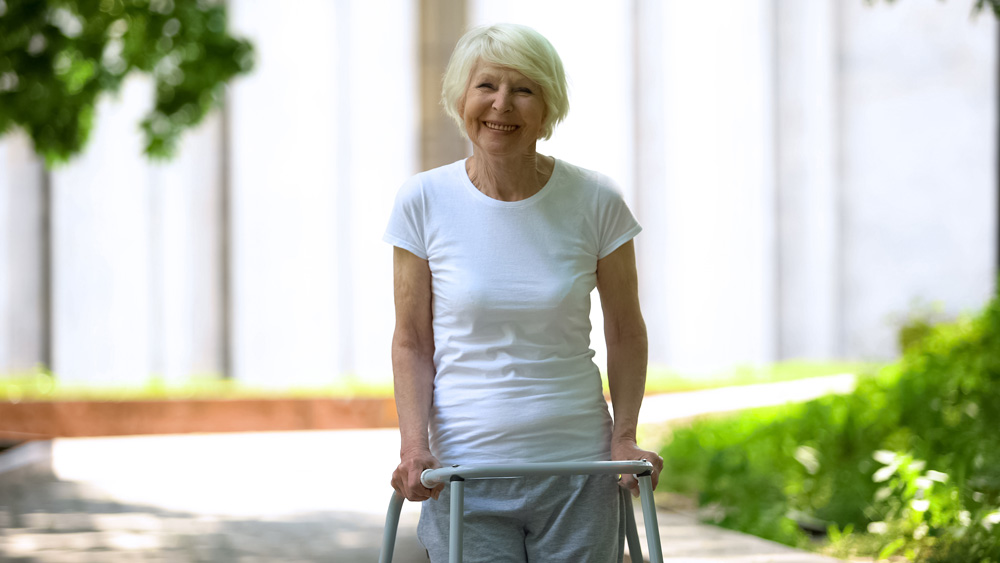 Cherie elderly lady walking with a walking frame.